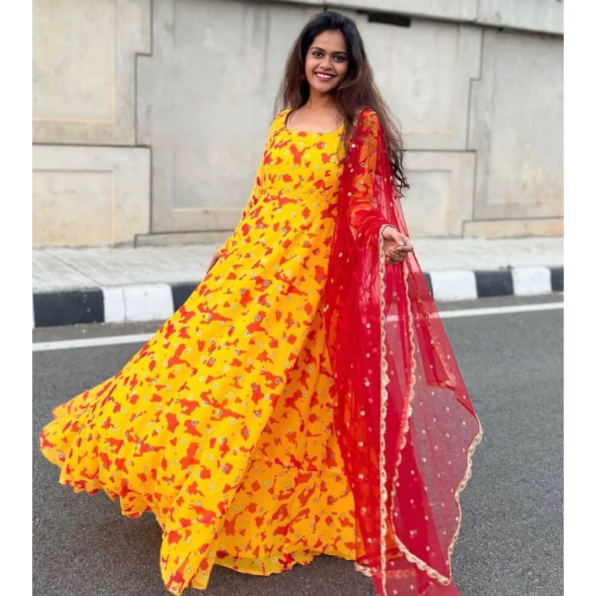 yellow Georgette gown with net dupatta